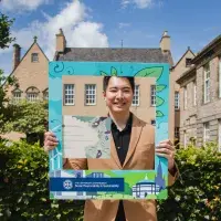 Changemaker hold certificates and poses in SRS selfie frame